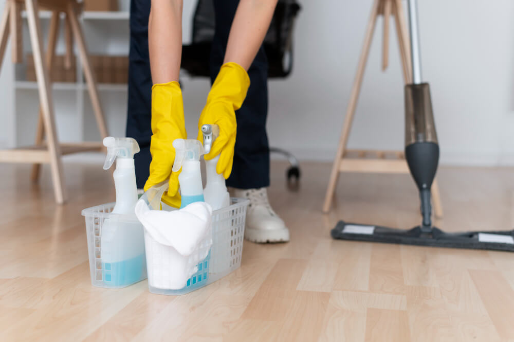a professional cleaner fixing the cleaning tools in a container